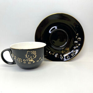 Sanrio Hello Kitty Tea Cup and Saucer Set 12 Oz. 2017 Black gold accents
